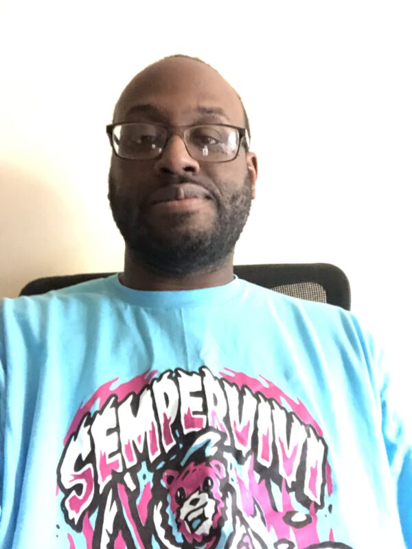 Award Winning Wrestling Podcaster Kenny Cummings wearing our Sempervivi Reaper Bear Shirt